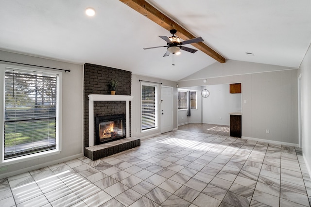 unfurnished living room featuring vaulted ceiling with beams, ceiling fan, and a brick fireplace