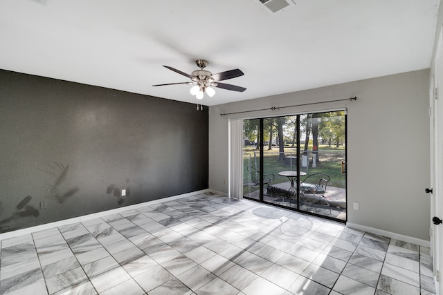 spare room with ceiling fan