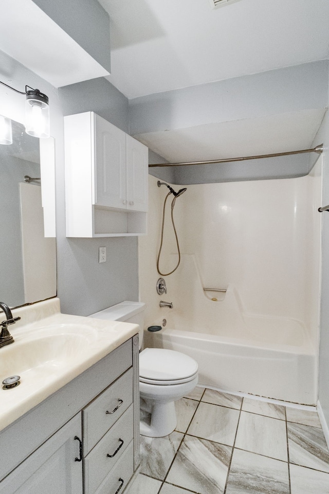 full bathroom featuring vanity, shower / bath combination, and toilet