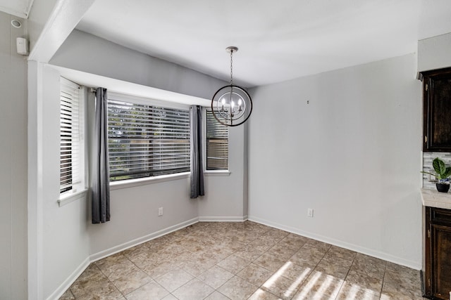 unfurnished dining area with a notable chandelier and light tile patterned flooring