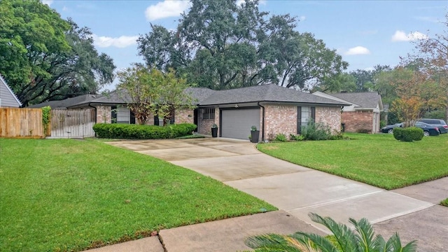 ranch-style house featuring a front yard and a garage