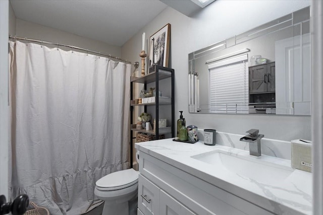 bathroom with vanity and toilet