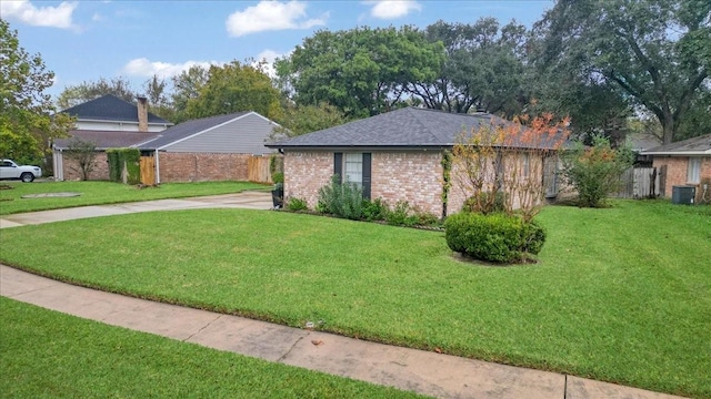 view of home's exterior featuring a yard and cooling unit