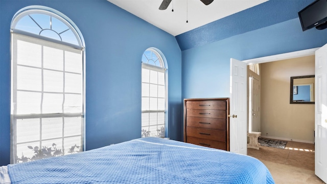 tiled bedroom with vaulted ceiling and ceiling fan