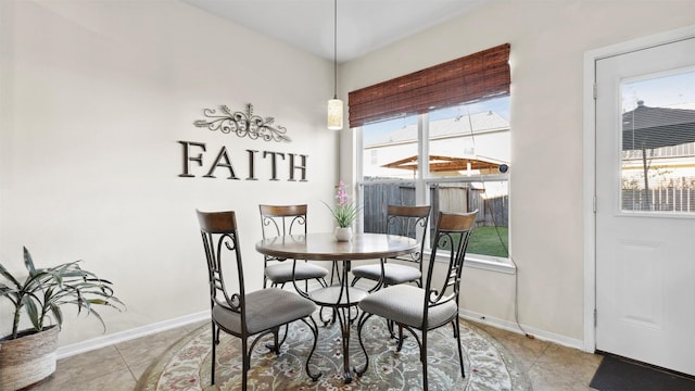 dining area featuring light tile patterned floors