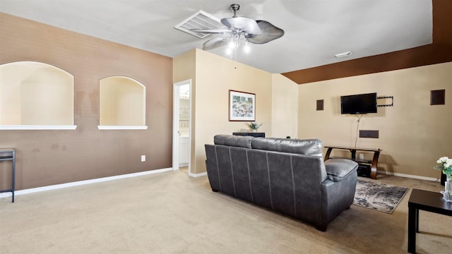 living room with ceiling fan and light colored carpet