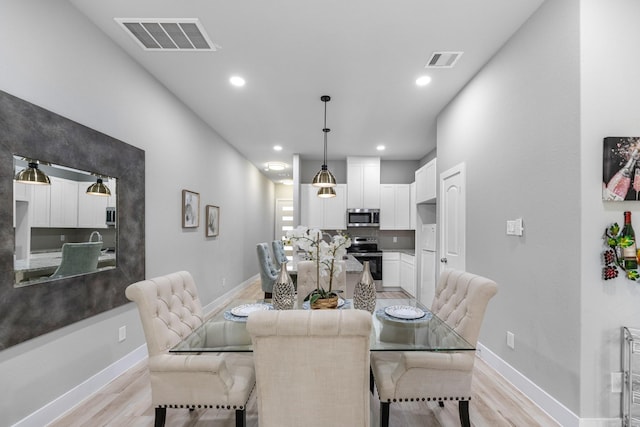 dining room featuring light hardwood / wood-style flooring