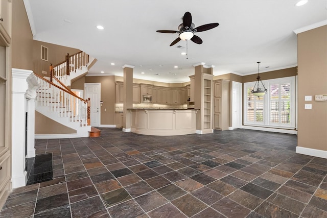 unfurnished living room with ceiling fan and crown molding