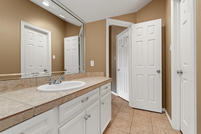 bathroom featuring tile patterned floors and vanity