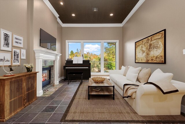 living room with a fireplace and ornamental molding