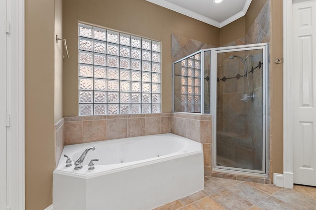 bathroom with crown molding and shower with separate bathtub