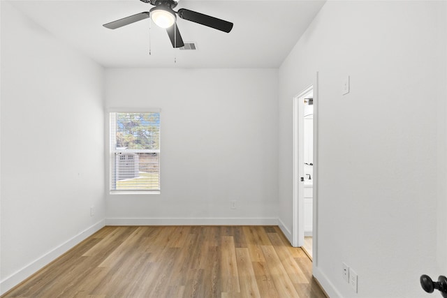 spare room with ceiling fan and light hardwood / wood-style floors