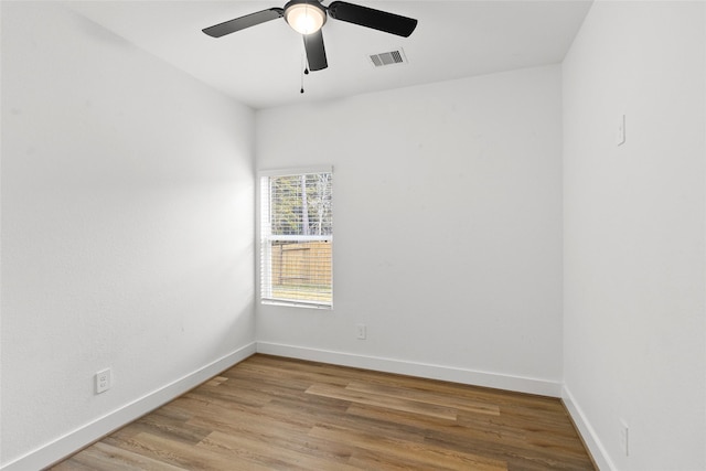 spare room with ceiling fan and light hardwood / wood-style floors