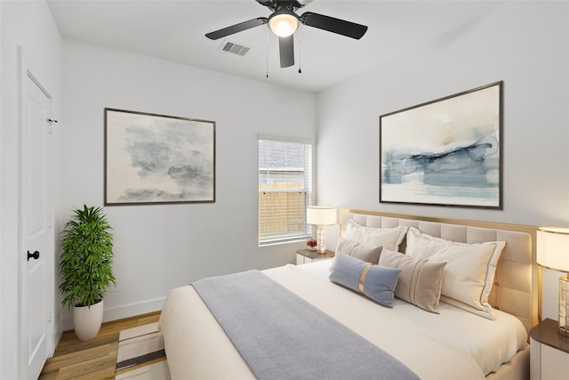 bedroom featuring ceiling fan and light wood-type flooring