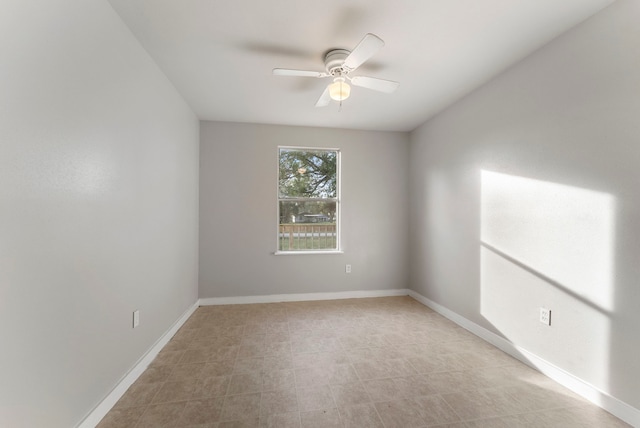 empty room featuring ceiling fan