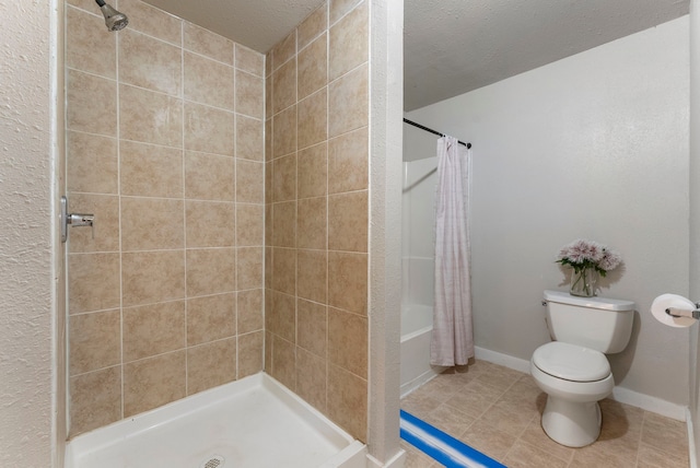 bathroom featuring tile patterned floors, toilet, a textured ceiling, and walk in shower