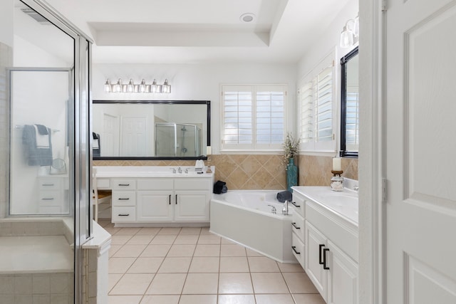 bathroom featuring tile patterned floors, vanity, and independent shower and bath