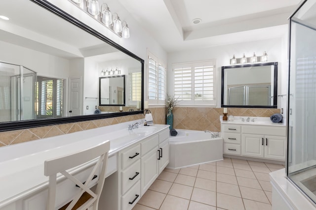 bathroom with tile patterned flooring, vanity, and separate shower and tub