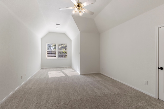 bonus room featuring light carpet, ceiling fan, and lofted ceiling