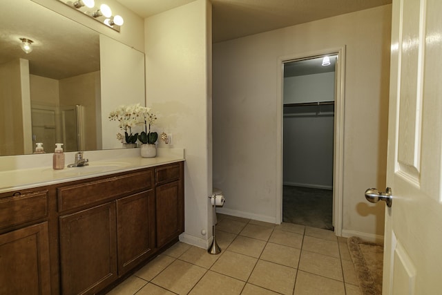 bathroom featuring tile patterned floors and vanity