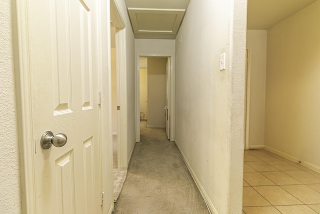 corridor with light tile patterned flooring