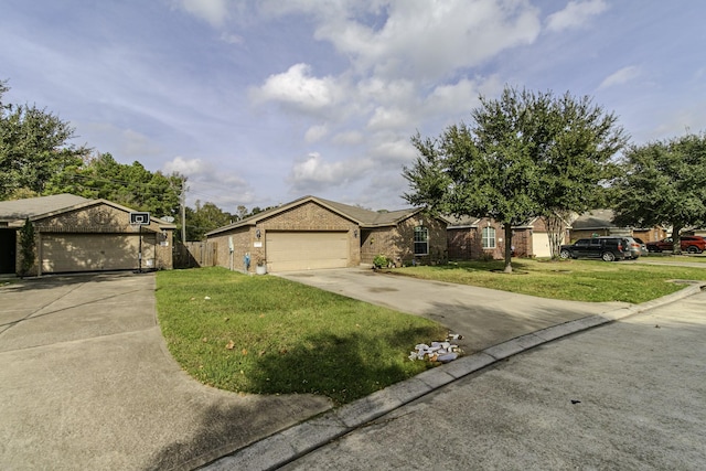 ranch-style house featuring a front yard and a garage