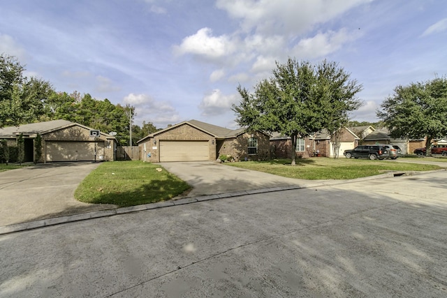 ranch-style house featuring a front yard and a garage