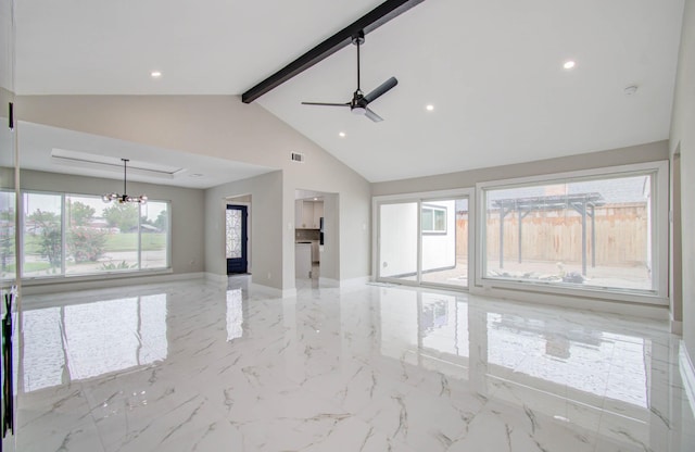 unfurnished living room with beam ceiling, ceiling fan with notable chandelier, high vaulted ceiling, and a wealth of natural light