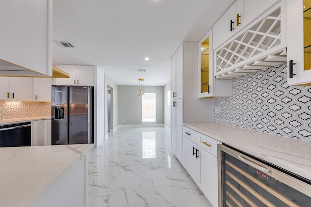 kitchen featuring dishwasher, wine cooler, stainless steel fridge with ice dispenser, backsplash, and white cabinets