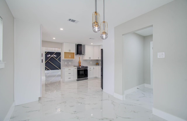 kitchen featuring white cabinetry, electric range, wall chimney exhaust hood, hanging light fixtures, and backsplash