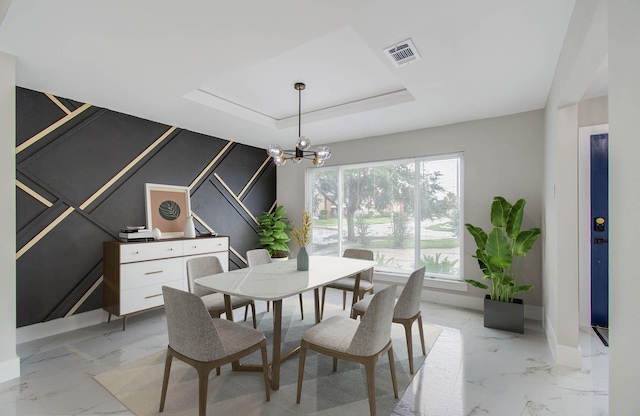 dining space featuring a chandelier