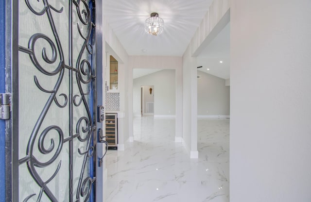 foyer entrance with a notable chandelier