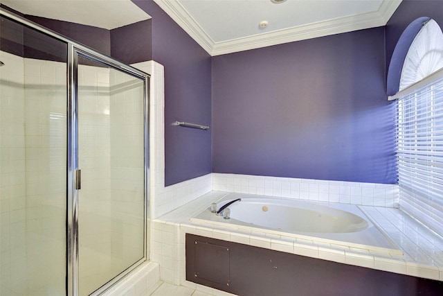 bathroom with tile patterned flooring, separate shower and tub, and ornamental molding