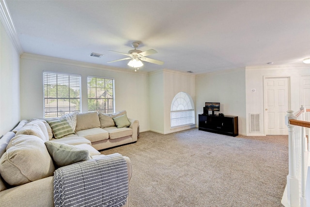 living room featuring light colored carpet, ceiling fan, and crown molding