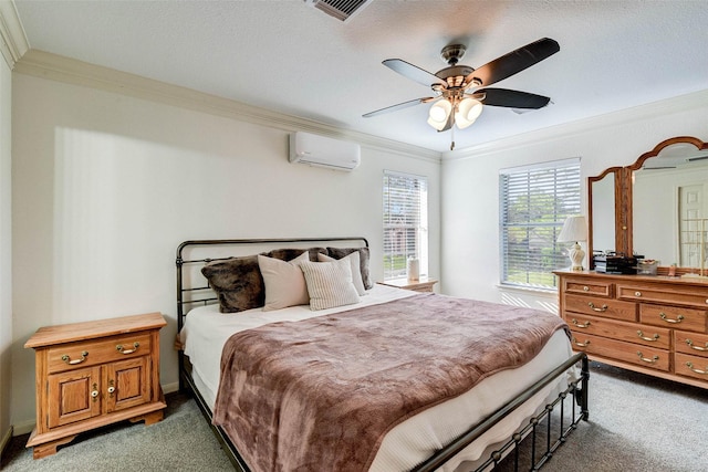 bedroom featuring ceiling fan, dark carpet, crown molding, and a wall mounted AC