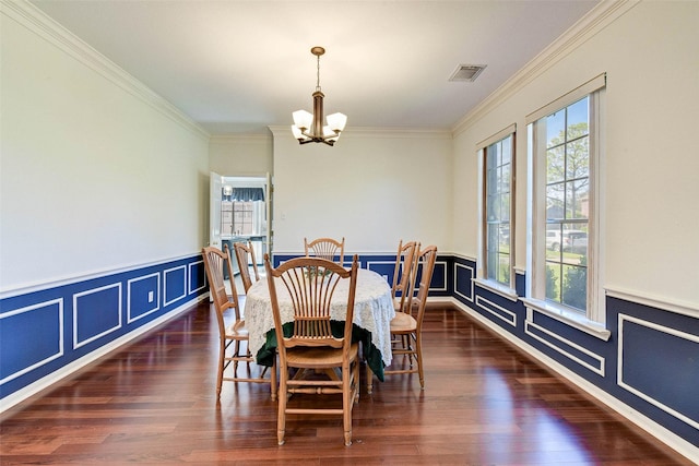 dining room featuring a chandelier, dark hardwood / wood-style floors, and a wealth of natural light