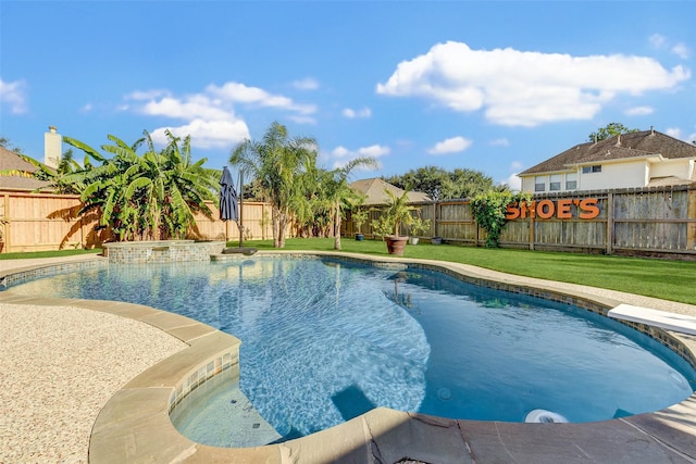 view of pool featuring a yard