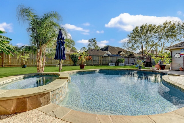 view of swimming pool featuring an in ground hot tub, a yard, and a playground