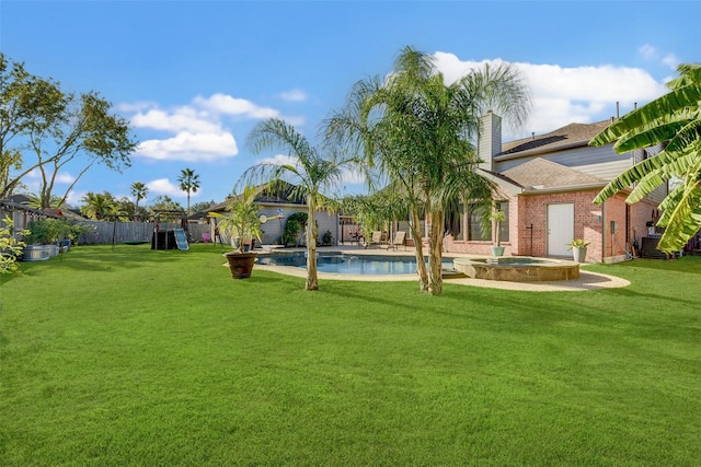 view of yard with a swimming pool with hot tub and cooling unit