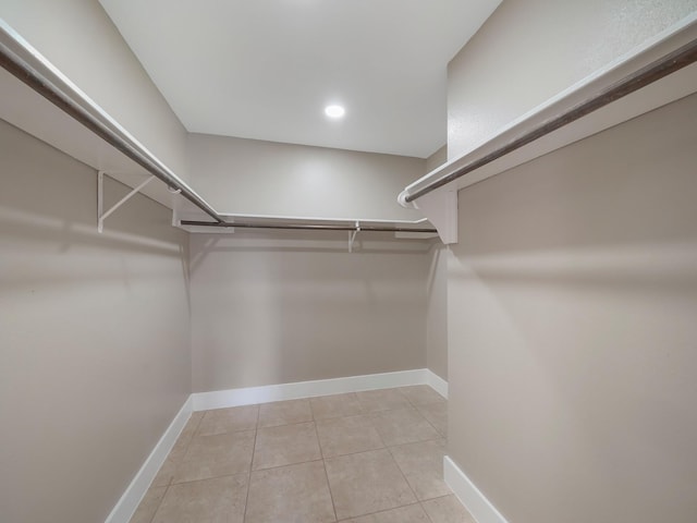 spacious closet featuring light tile patterned floors