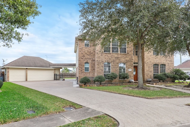 view of front of home with a garage and a front lawn