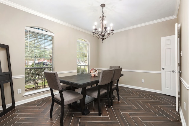 dining room with dark parquet flooring, a chandelier, crown molding, and a healthy amount of sunlight