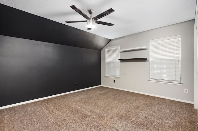 additional living space featuring ceiling fan, carpet, and lofted ceiling