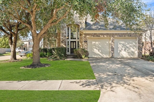 view of front facade featuring french doors, a front yard, and a garage