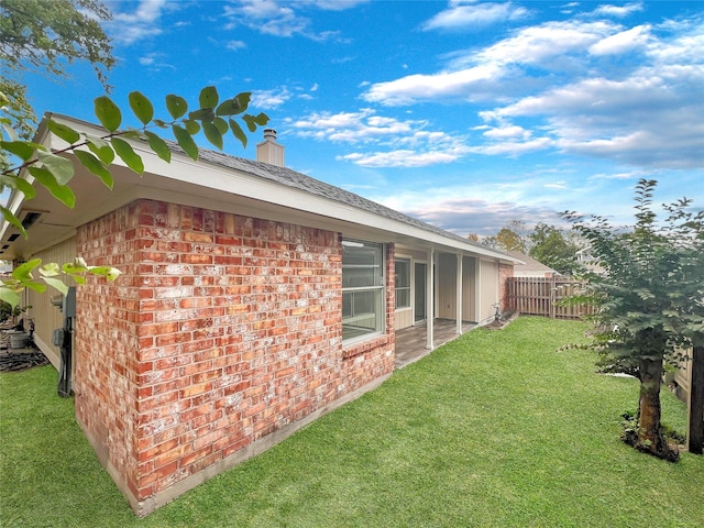 view of property exterior with a lawn