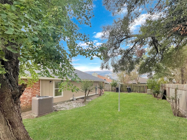 view of yard with central AC