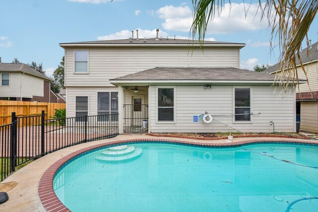 view of pool featuring ceiling fan