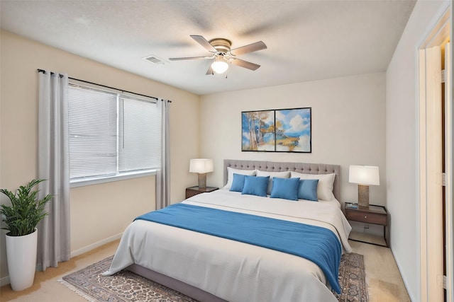 bedroom with light colored carpet and ceiling fan