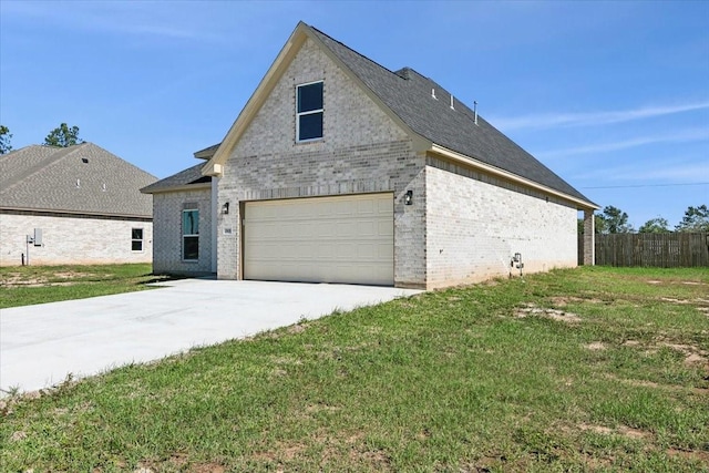 view of front of property with a front lawn and a garage