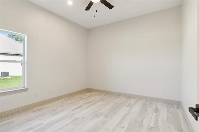 empty room featuring ceiling fan and light hardwood / wood-style floors